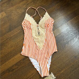 Orange and white striped one piece swimsuit
